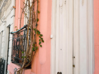 pink building with white door in South America